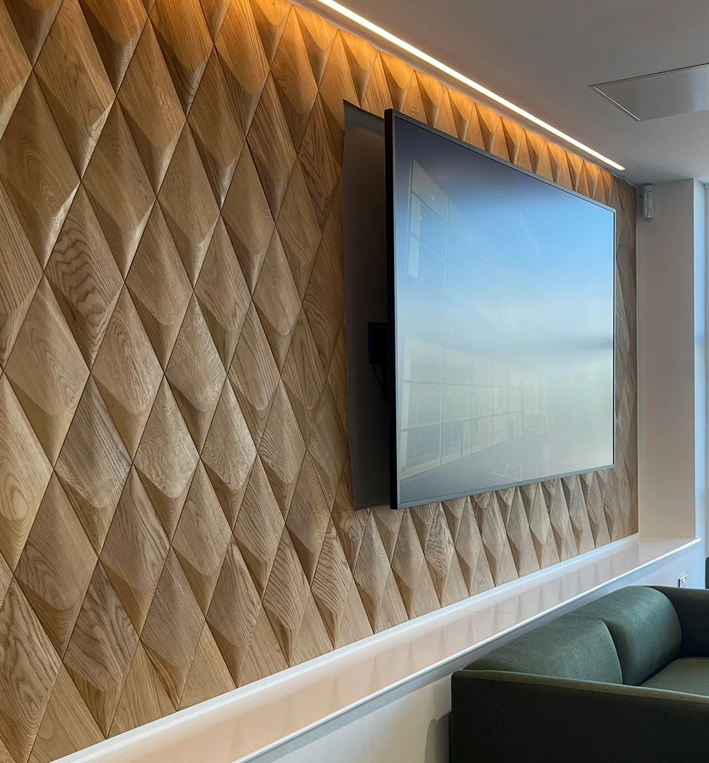 Modern TV wall design featuring 3D oak diamond-shaped wood panels with integrated top LED strip lighting.