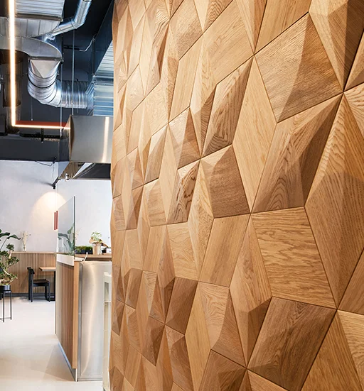 Modern living room fireplace wall decorated with geometric wooden panels.