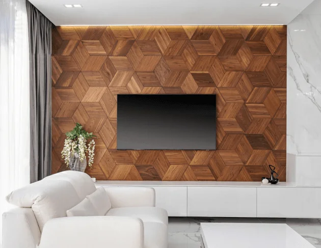 Modern TV feature wall with 3D walnut wood geometric panels in a hexagonal arrangement, featuring white furniture and marble accents.