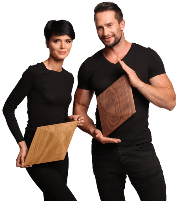 Photo of a man and woman holding wooden panels