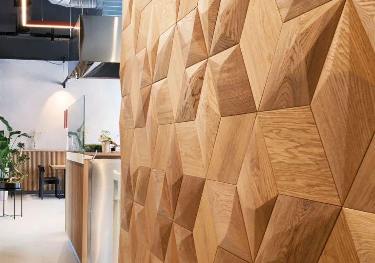 Close-up of oak 3D wall paneling with deep textured geometry