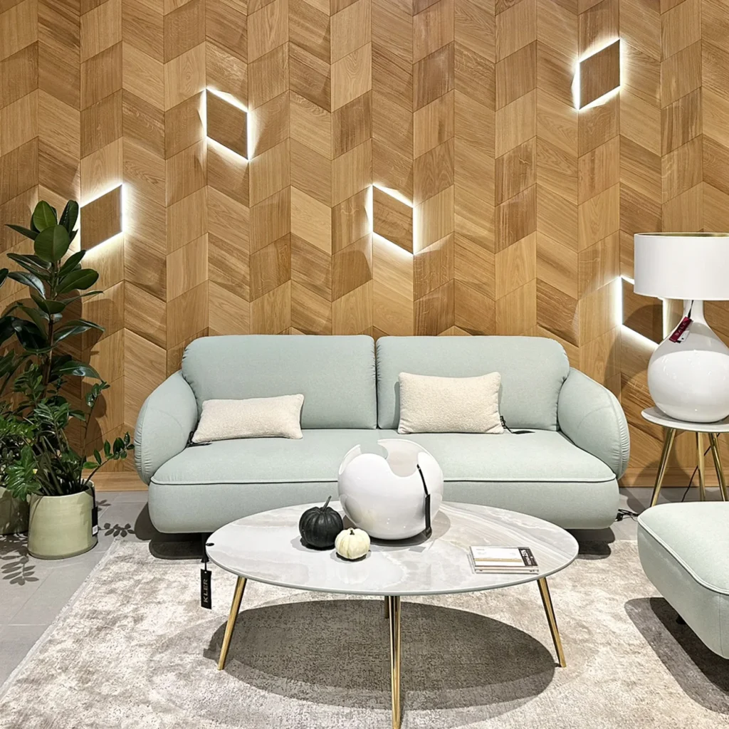 Oak wood wall panels used as modern accent wall behind white sofa