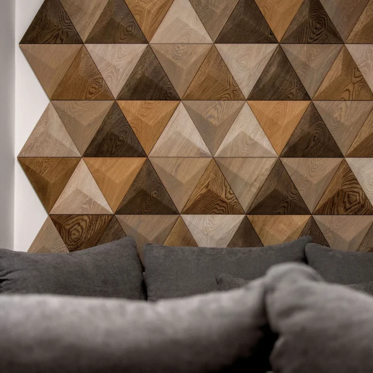Triangle-shaped wood panels creating decorative wall above grey sofa