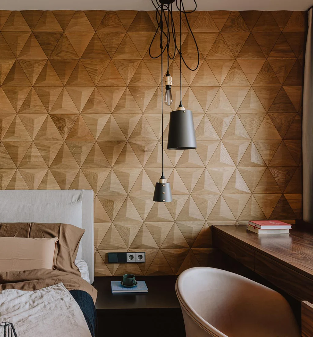 Elegant bedroom featuring a 3D oak triangle wood panel accent wall with modern pendant lighting.